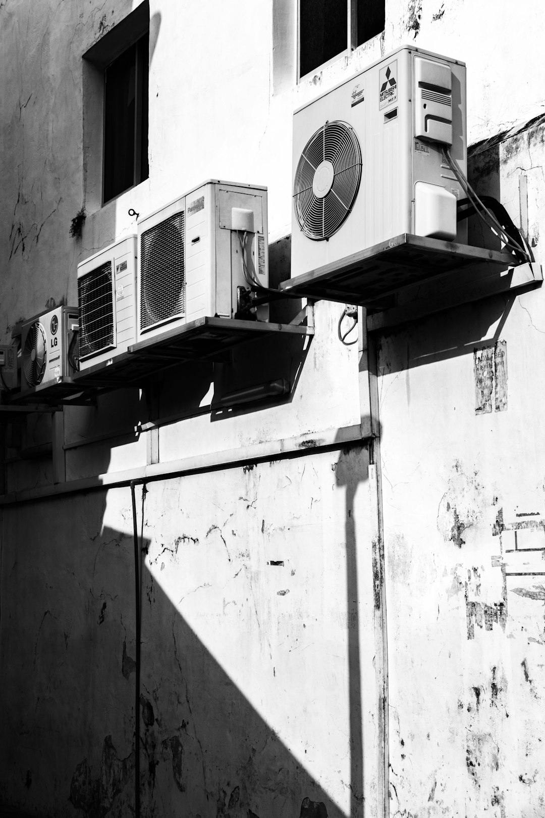 Services-01 greyscale-photography-of-ac-units-ymmasat-ias