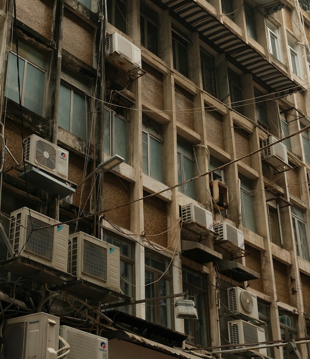 creative old-building-with-numerous-air-conditioning-units-jneiw2w2-4g